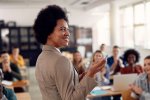 black woman teaches in a classoom